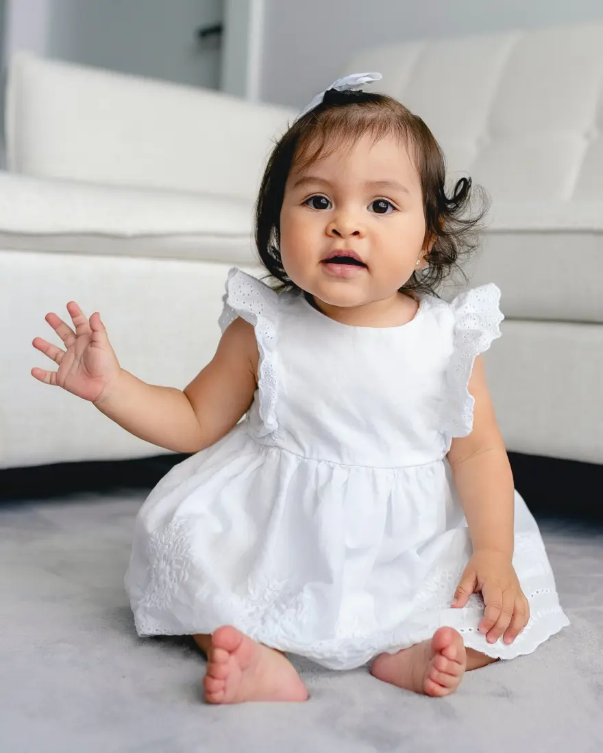Baby sitting on floor in living room