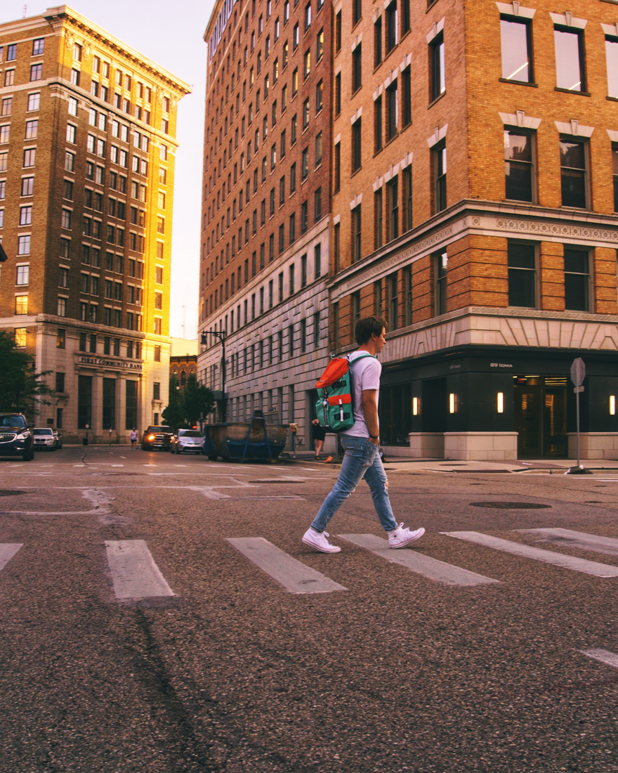Young adult walking in downtown Grand Rapids