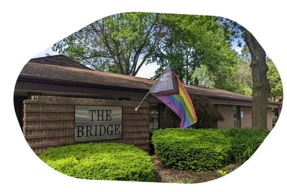 The Bridge of Arbor Circle with rainbow flag outside