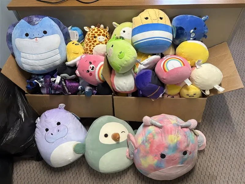 Box of squishmallow toys